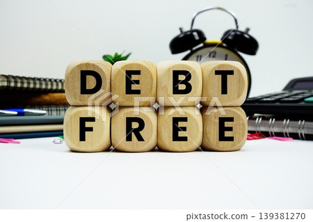 Debt Free alphabet letters with calculator and alarm clock on white background 139381270