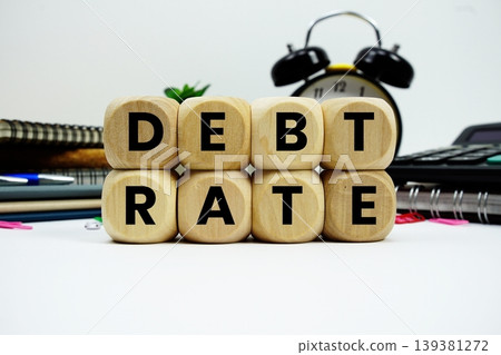 Debt Rate alphabet letters with calculator and alarm clock on white background Debt Rate alphabet letters with calculator and alarm clock on white background 139381272
