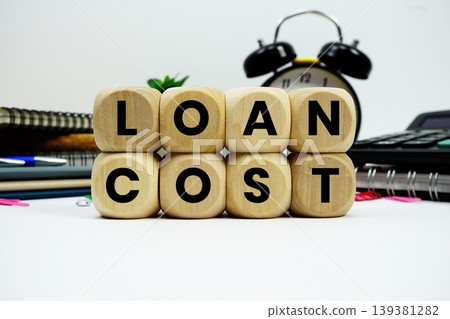 Loan Cost alphabet letters with calculator and alarm clock on white background Loan Cost alphabet letters with calculator and alarm clock on white background 139381282