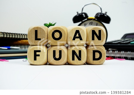 Loan Fund alphabet letters with calculator and alarm clock on white background Loan Fund alphabet letters with calculator and alarm clock on white background 139381284