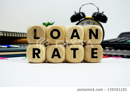 Loan Rate alphabet letters with calculator and alarm clock on white background Loan Rate alphabet letters with calculator and alarm clock on white background 139381285