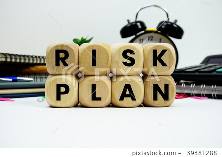 Risk Plan alphabet letters with calculator and alarm clock on white background Risk Plan alphabet letters with calculator and alarm clock on white background 139381288