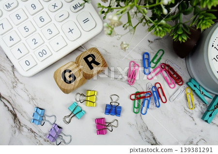 HP (High Price) alphabet letters with calculator and alarm clock on marble background HP (High Price) alphabet letters with calculator and alarm clock on marble background 139381291