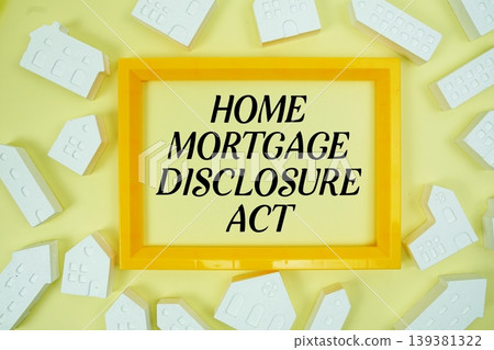 Home Mortgage Disclosure Act text with house models on yellow background Home Mortgage Disclosure Act text with house models on yellow background 139381322