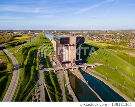 Drone shot of boat lift casting shadow over green spring valley 139381365