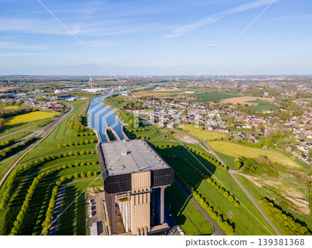 Symmetrical drone view along canal axis toward boat lift Symmetrical drone view along canal axis toward boat lift 139381368