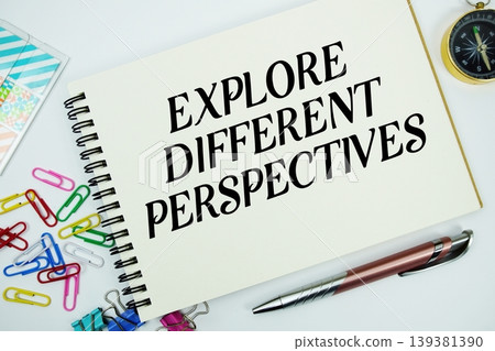 Explore Different Perspectives text message written on notepad with stationery flat lay on white background Explore Different Perspectives text message written on notepad with stationery flat lay on white background 139381390