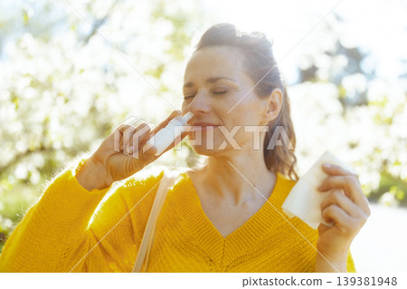 Close-up of Woman Using Nasal Spray for Hay Fever 139381948