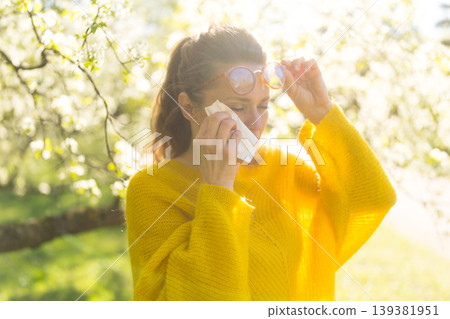 Seasonal Allergic Rhinitis Treatment in a Spring Orchard Seasonal Allergic Rhinitis Treatment in a Spring Orchard 139381951