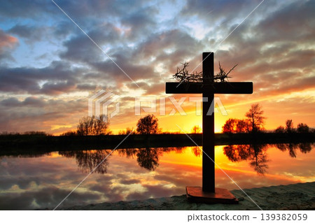 Cross With Crown of Thorns Reflection Waters Sunset Cross With Crown of Thorns Reflection Waters Sunset 139382059