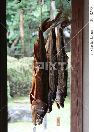 Dried fish hanging out to dry on the eaves Dried fish hanging out to dry on the eaves 139382723