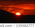 The sun setting in the mountain 139382777