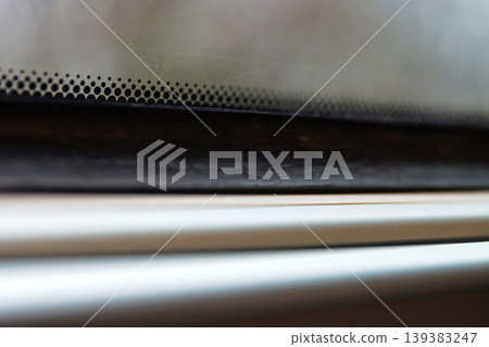 Rainy train window with raindrops and blurred winter trees outside. minimal travel scene with shallow depth of field, motion blur, and soft light. Rainy train window with raindrops and blurred winter trees outside. minimal travel scene with shallow depth of field, motion blur, and soft light. 139383247