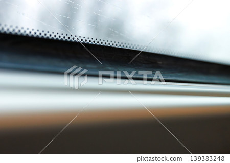 Rainy train window with raindrops and blurred winter trees outside. minimal travel scene with shallow depth of field, motion blur, and soft light. Rainy train window with raindrops and blurred winter trees outside. minimal travel scene with shallow depth of field, motion blur, and soft light. 139383248