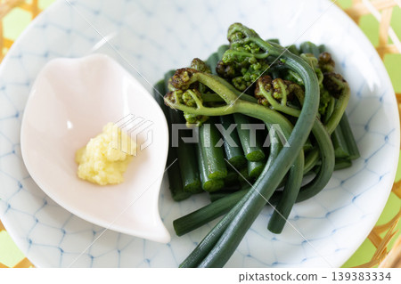 Blanched bracken served on a Japanese plate Blanched bracken served on a Japanese plate 139383334