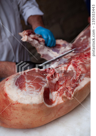 Working on a block in a butchery shop Working on a block in a butchery shop 139383443
