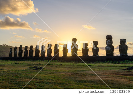 Serene moai statue silhouette at sunrise on easter island chile Serene moai statue silhouette at sunrise on easter island chile 139383569