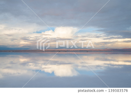 Serene sky and cloud reflection on salt flat in uyuni bolivia Serene sky and cloud reflection on salt flat in uyuni bolivia 139383576
