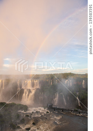 Breathtaking iguazu falls creating massive mist and bright rainbow Breathtaking iguazu falls creating massive mist and bright rainbow 139383591