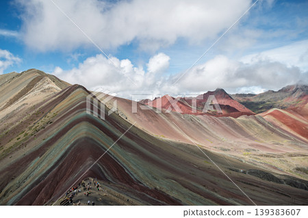 Breathtaking vinicunca rainbow mountain peak shows colorful nature landscape under blue sky Breathtaking vinicunca rainbow mountain peak shows colorful nature landscape under blue sky 139383607