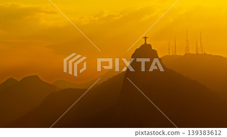 Majestic Christ Redeemer statue silhouette on mountain at sunset serene landscape in Rio de Janeiro Brazil Majestic Christ Redeemer statue silhouette on mountain at sunset serene landscape in Rio de Janeiro Brazil 139383612