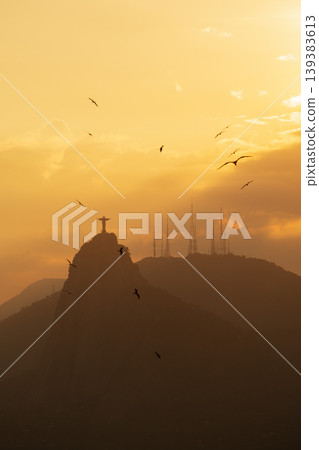 Serene silhouette of Christ Redeemer statue on Corcovado mountain at sunset over Rio de Janeiro Brazil majestic view Serene silhouette of Christ Redeemer statue on Corcovado mountain at sunset over Rio de Janeiro Brazil majestic view 139383613