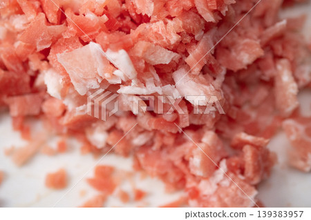 This is an image of finely chopped frozen pork. This is an image of finely chopped frozen pork. 139383957