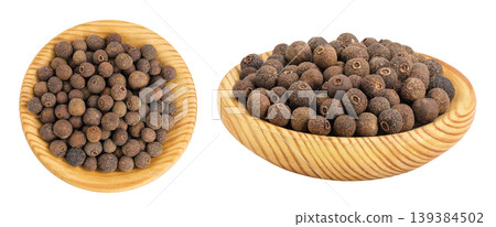 Allspice pepper in wooden bowl isolated on white background. Jamaica pepper, Pimenta dioica or myrtle pepper. Top view Allspice pepper in wooden bowl isolated on white background. Jamaica pepper, Pimenta dioica or myrtle pepper. Top view 139384502