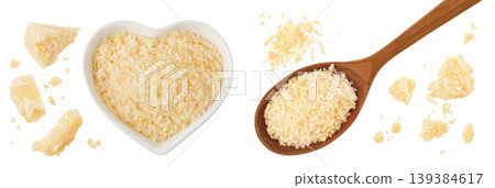 grated parmesan cheese in ceramic bowl and wooden spoon isolated on white background. Top view. Flat lay 139384617