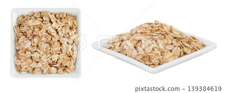 Oat flakes in ceramic bowl isolated on white background with full depth of field. Top view. Flat lay 139384619