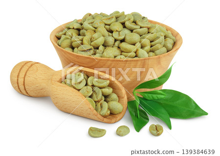 Green coffee beans in wooden bowl and scoop isolated on white background 139384639