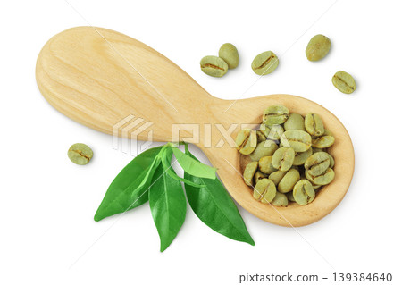 Green coffee beans in wooden spoon isolated on white background. Top view Green coffee beans in wooden spoon isolated on white background. Top view 139384640