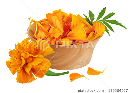 petals of fresh marigold or tagetes erecta flower in wooden bowl isolated on white background with full depth of field. petals of fresh marigold or tagetes erecta flower in wooden bowl isolated on white background with full depth of field. 139384937