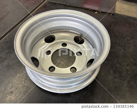 The back of a steel wheel for a truck The back of a steel wheel for a truck 139385146