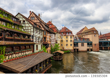 Traditional half-timbered houses on the canals district Petite France in Strasbourg, Alsace, France. UNESCO World Heritage Site Traditional half-timbered houses on the canals district Petite France in Strasbourg, Alsace, France. UNESCO World Heritage Site 139385304
