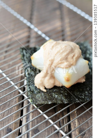 Freshly baked taramayo isobe mochi placed on a cake cooler 139385517