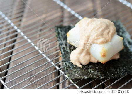 Freshly baked taramayo isobe mochi placed on a cake cooler Freshly baked taramayo isobe mochi placed on a cake cooler 139385518