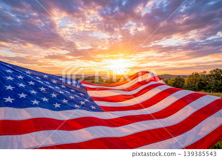 The American flag fluttering in the sunset sky 139385543