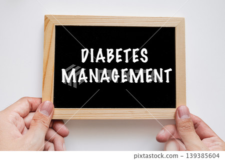 Hands holding chalkboard sign with Diabetes Management, healthcare medical awareness concept Hands holding chalkboard sign with Diabetes Management, healthcare medical awareness concept 139385604