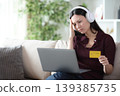 Worried asian woman paying media content online 139385735