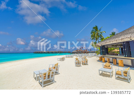 Exclusive Maldives beach luxury hobo style with barefoot elegance featuring rustic chic textures and a serene turquoise ocean background Exclusive Maldives beach luxury hobo style with barefoot elegance featuring rustic chic textures and a serene turquoise ocean background 139385772