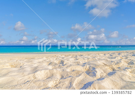 Closeup sunny sandy beach blue ocean sky idyllic summer copy space tropical mediterranean nature outdoors background amazing coastal landscape serene turquoise water shore tranquil scenery Closeup sunny sandy beach blue ocean sky idyllic summer copy space tropical mediterranean nature outdoors background amazing coastal landscape serene turquoise water shore tranquil scenery 139385782