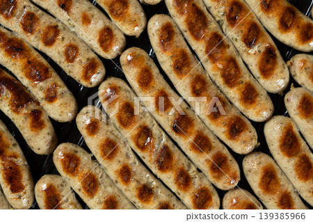 Batch of Sausages Roasting on Modern Electric Home Grill Batch of Sausages Roasting on Modern Electric Home Grill 139385966