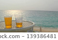 Beer while overlooking the ocean on a resort beach 139386481