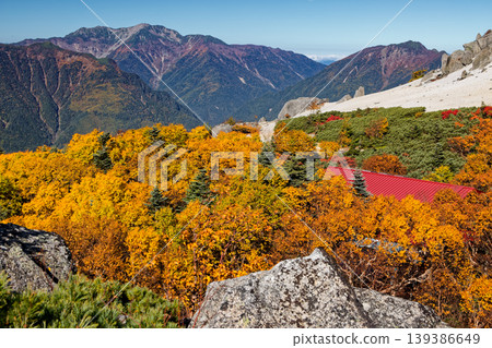 Autumn foliage in the Southern Alps: Mt. Houou and Mt. Sunaharai, as seen from Mt. Senjogatake. Autumn foliage in the Southern Alps: Mt. Houou and Mt. Sunaharai, as seen from Mt. Senjogatake. 139386649