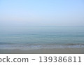 Calm clear sea meeting sandy beach horizon 139386811