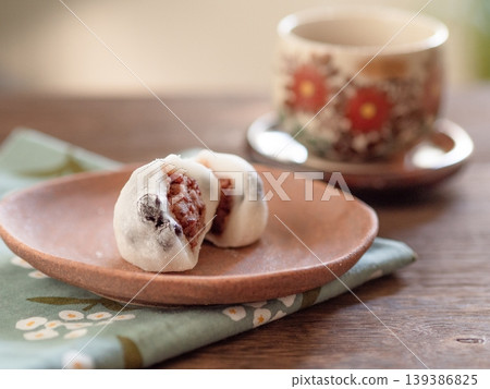 Soft bean paste mochi and warm tea. Cross-section Soft bean paste mochi and warm tea. Cross-section 139386825