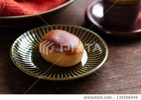 A chestnut bun served in a bowl. A traditional Japanese confection. A chestnut bun served in a bowl. A traditional Japanese confection. 139386849