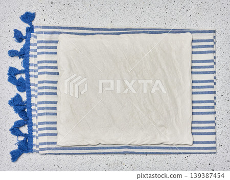 White rectangular ceramic serving board on striped textile napkin White rectangular ceramic serving board on striped textile napkin 139387454