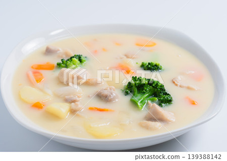 Cream stew, a hearty stew with chicken and vegetables, on a white background. Cream stew, a hearty stew with chicken and vegetables, on a white background. 139388142